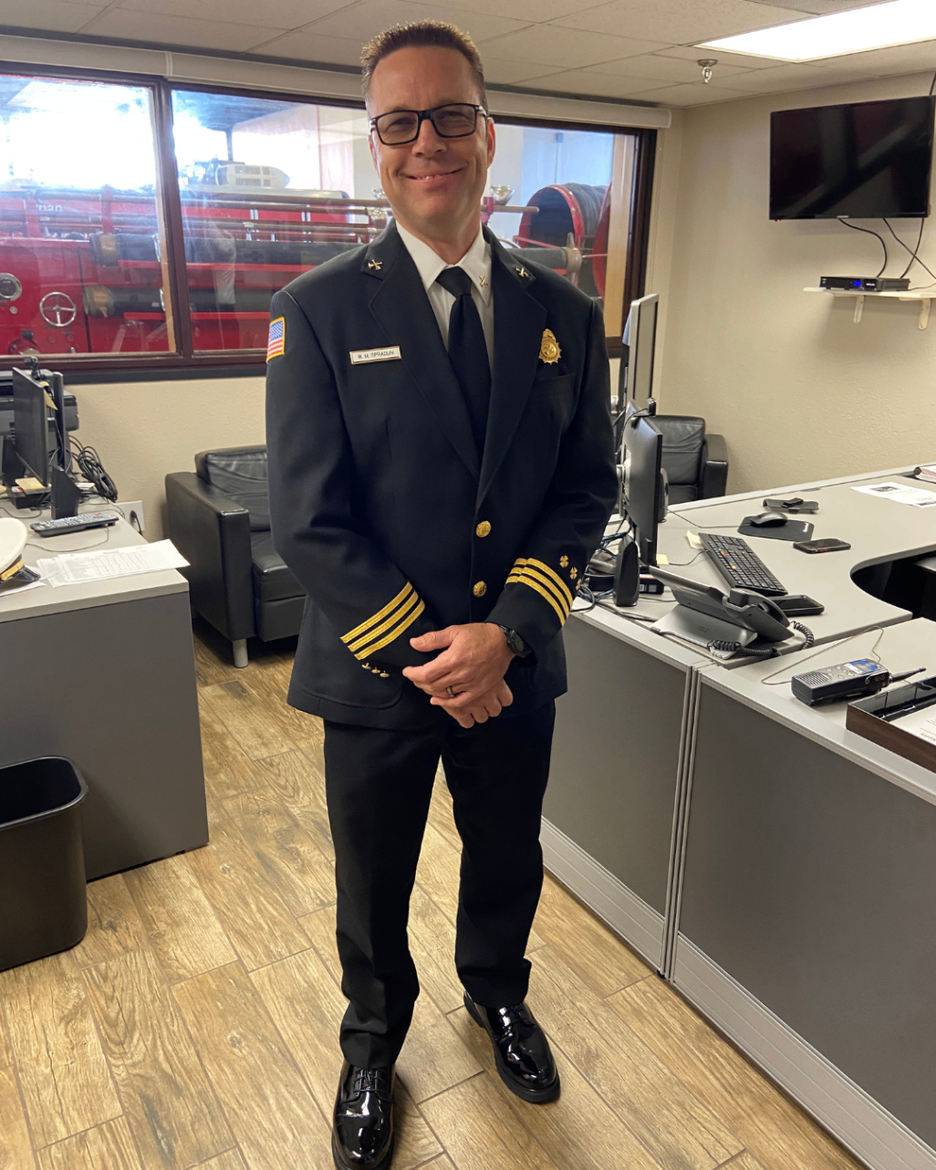 Mitch in his Tampa Fire Rescue District Chief dress uniform at the fire station