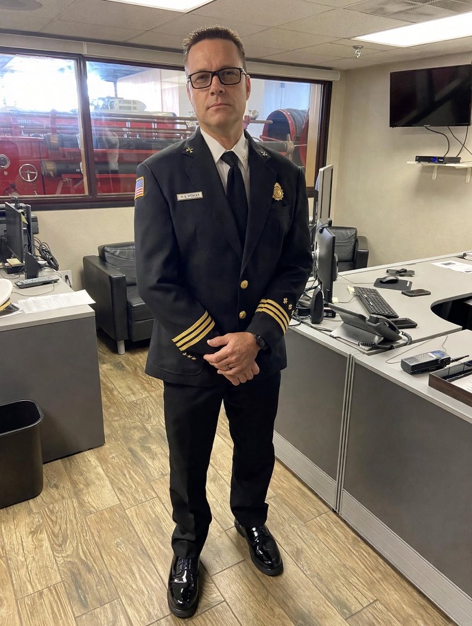 Mitch in his Tampa Fire Rescue District Chief dress uniform at the fire station